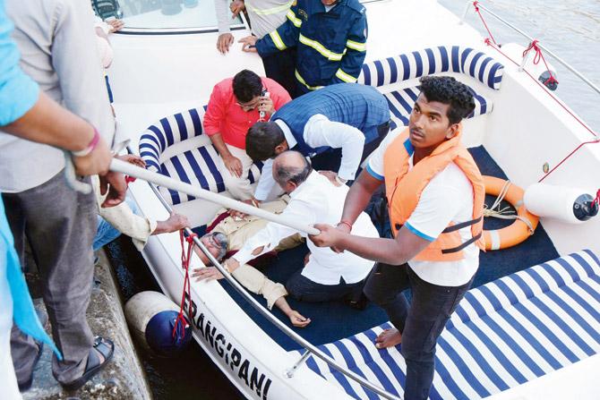 People on the boat being helped ashore on Wednesday. Pic/Suresh Karkera