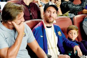 Injured Messi and son Thiago watch Barcelona beat Inter from stands