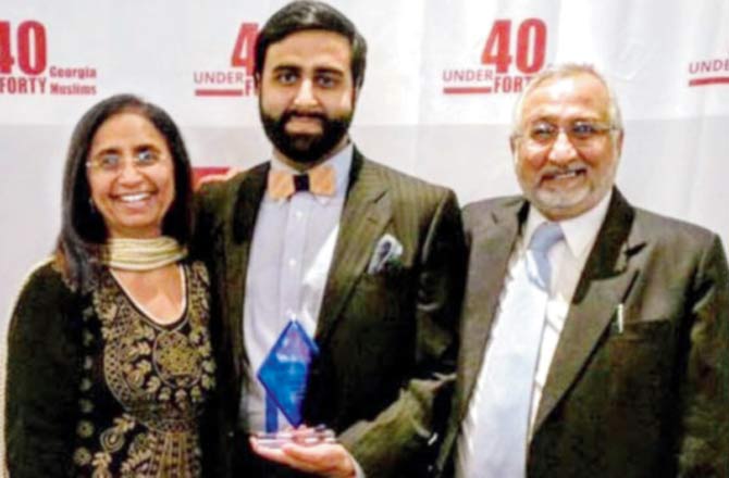 Mirza (right) lives in Atlanta, Georgia, with his wife and son