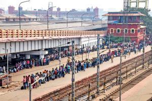 Passengers wait in queues at a platform at Santragachi station a day after a stampede took place at the premises in West Bengal. Pic/PTI