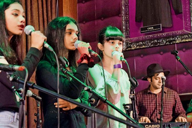 Ariana (in white), daughter of Mahima Chaudhuri (below), performs live at the Crossroads music festival, with Soumya Maradona Ghosh (right). Pic/Ashish Raje
