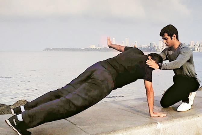 Vinay Bhambwani (kneeling down)