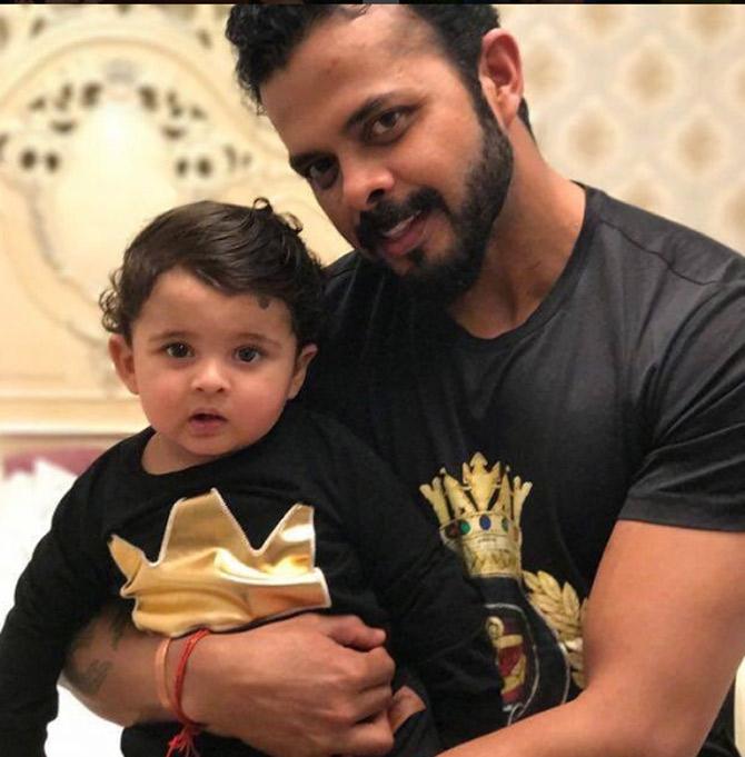 In picture: Sreesanth posing with his daughter