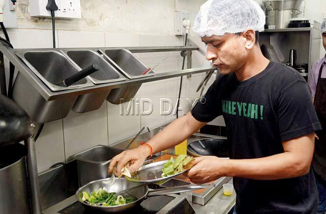 Chef Vikram prepares and packs Baked Miso Salmon at Hello Green in Andheri. Pic/Sneha Kharabe