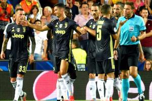 Ronaldo sent off but 10-man Juventus ease past Valencia