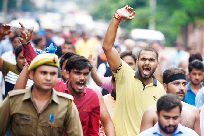 General category and OBC groups take part in a protest in Allahabad. Pics/PTI/AFP