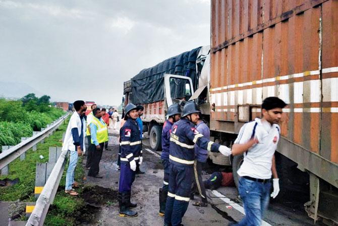 The driver of a truck died when it collided with a container