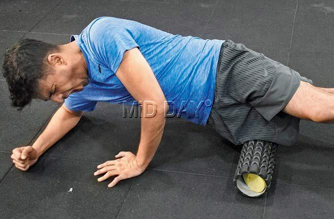 Rohan Joshi employs the foam rolling technique to release muscle tension