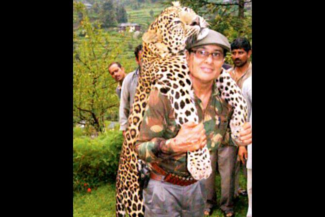 The hunter with a leopard he shot in Himachal Pradesh in 2013