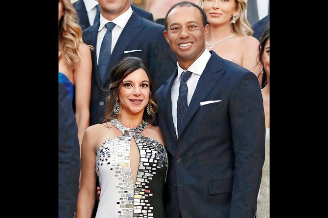 Tiger Woods poses with girlfriend Erica Herman