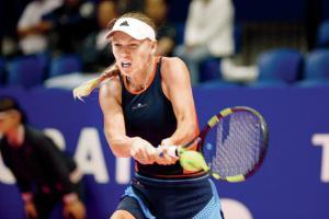 Champion Caroline Wozniacki crashes out in Tokyo