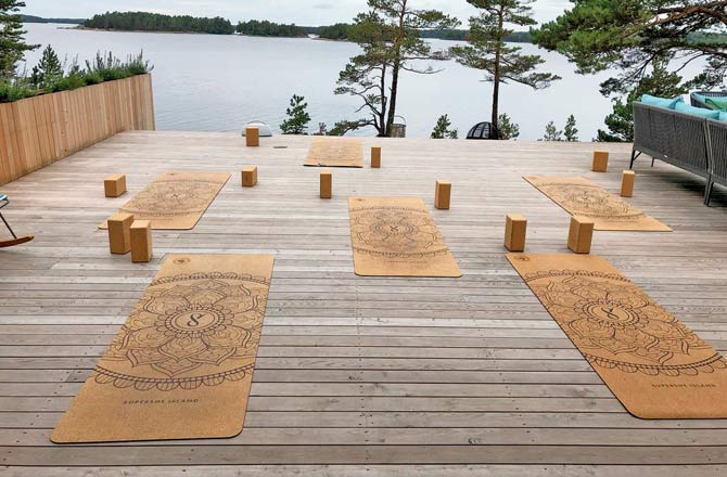 Cork mats laid out for morning yoga on the air deck