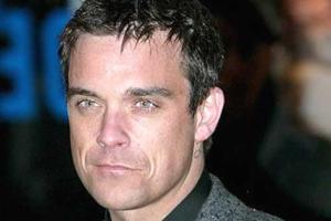 When Robbie Williams kept his surrogate baby girl a secret 