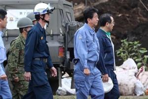 Japan PM Shinzo Abe visits quake-hit Hokkaido as toll rises to 37