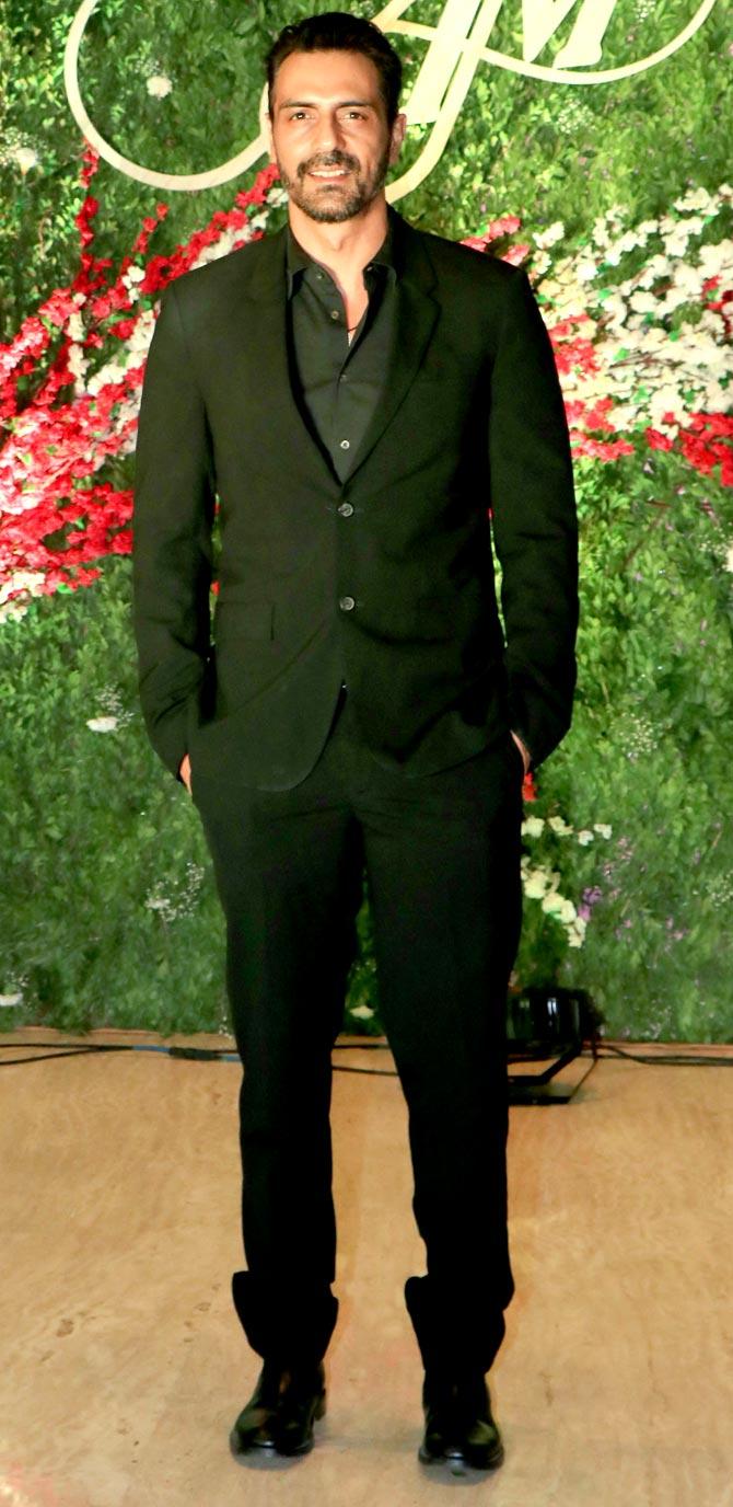 Arjun Rampal opted for an all-black suit to attend Akshay Gada's wedding reception held at a plush hotel in Mumbai.