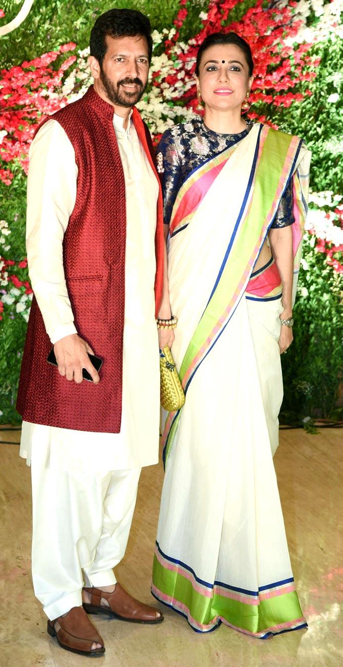 Kabir Khan and Mini Mathur were also clicked at the wedding reception. Mini opted for a white saree, which she paired it with a blue floral blouse, and Kabir was seen wearing a white pathani, with the burgundy coat.