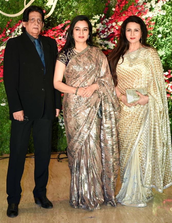 Pradeep Sharma with wife Padmini Kolhapure and veteran Bollywood actress Poonam Dhillon at Akshay Gada-Murup's wedding reception held in Mumbai.