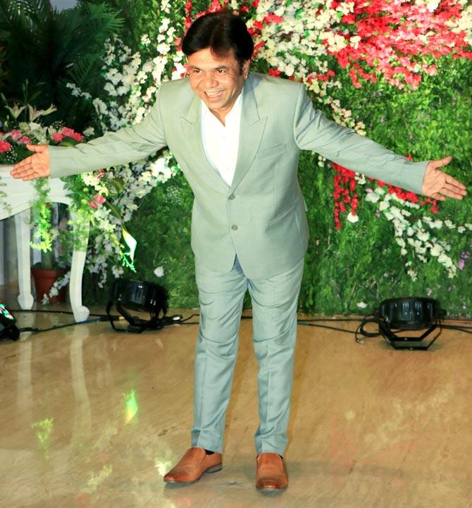 Rajpal Yadav was clicked posing for the shutterbugs at Akshay Gada's wedding reception held in the city.