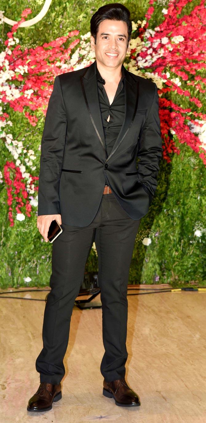 Tusshar Kapoor was all smiles when he was clicked at Akshay-Murup's wedding reception.