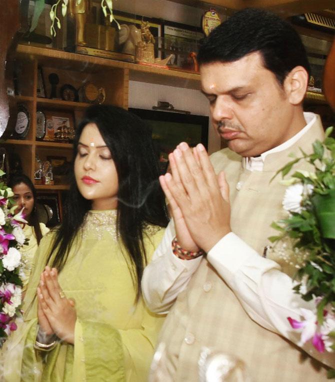In photo, Amruta and Devendra Fadnavis offer their prayers during an event in the city. 