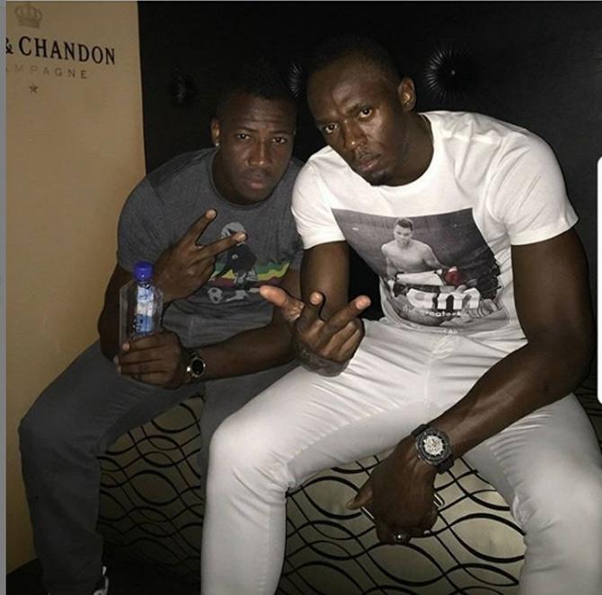 In picture: Andre Russell with Usain Bolt.