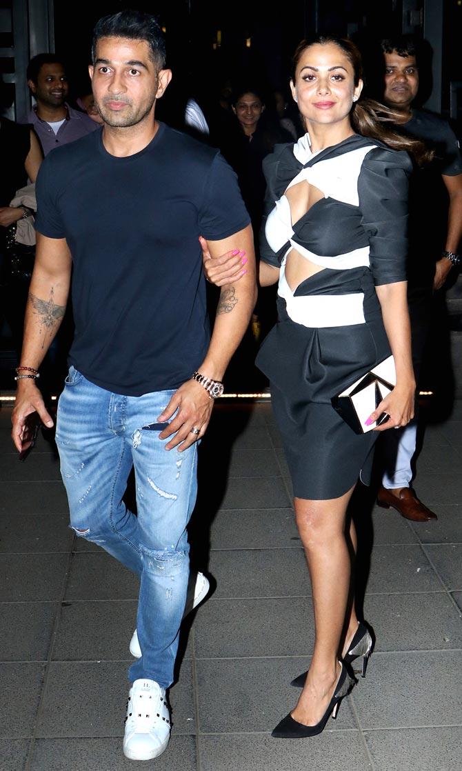 Shakeel Ladak and Amrita Arora Ladak posed for the paparazzi when clicked in the city. 