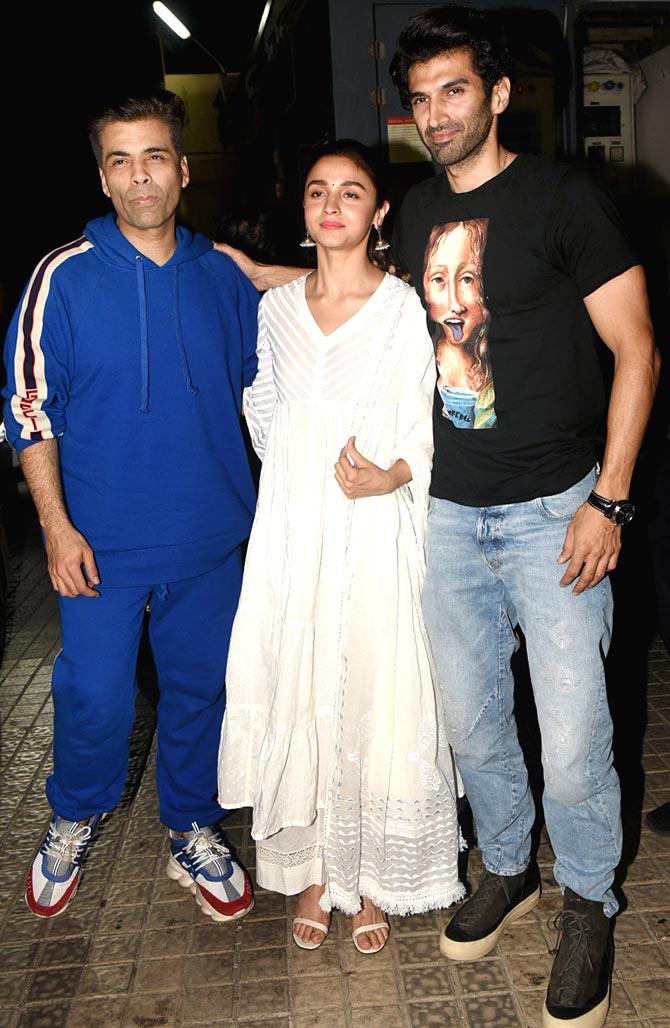 Producer Karan Johar, lead actors - Alia Bhatt and Aditya Roy Kapur posed for the shutterbugs as they arrived for the special screening of Kalank, held at a popular multiplex in Juhu, Mumbai. 