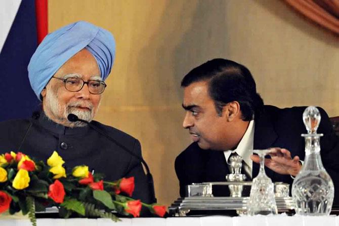 In picture: Former prime minister Manmohan Singh listens to Mukesh Ambani during a signing ceremony with Russian president Dmitry Medvedev (not pictured) in New Delhi on December 5, 2008