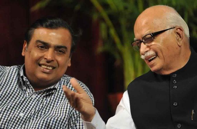 In picture: Mukesh Ambani listens to senior Bharatiya Janata Party (BJP) leader L.K. Advani during the book launch function by city's former sheriff Nana Chudasama, in Mumbai on June 17, 2010