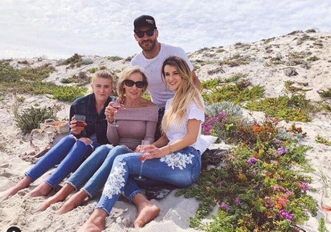 Faf du Plessis is a former captain of the South African team in all formats of international cricket.
Faf du Plessis posted this picture with wife Imari Visser, his mother and sister and captioned, 