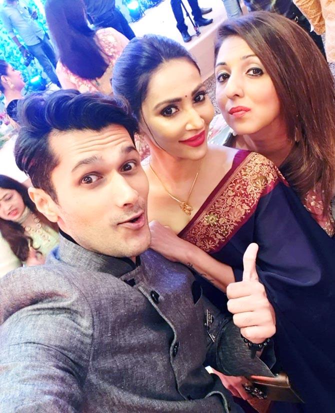 Abhay Vakil takes a selfie with Rishina Kandhari and Munisha Khatwani at Ssharad Malhotra and Ripci Bhatia's wedding ceremony, held in Mumbai.
