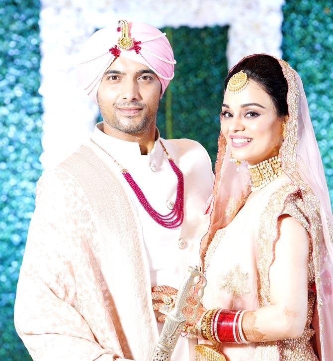 Ssharad Malhotra and Ripci Bhatia twinned in pink for their Anand Kalraj ceremony. Ripci wore a pink lehenga, while Ssharad sported a white sherwani with a pink turban.