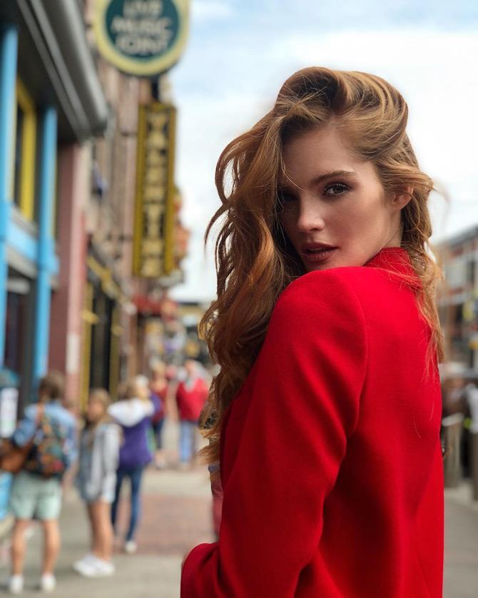 In pic: Alexina Graham shines in a red outfit as she poses for the camera.