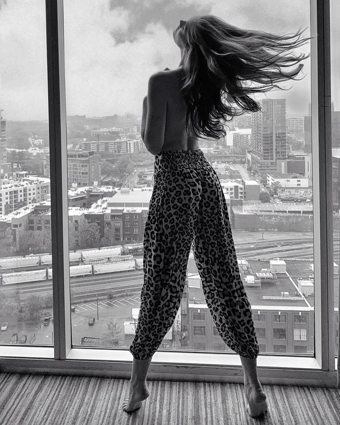 Alexina Graham is inspired by supermodels Adriana Lima and Candice Swanepoel.
In pic: Alexina Graham poses topless in an animal print pants as she captions it: When your bedhead turns out well.