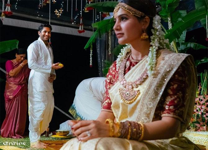 For her wedding, south star Samantha Akkineni wore husband Naga Chaitanya's grandmother's sari and teamed it up with a pretty maroon Sabyasachi blouse with gold threadwork featuring floral motifs. Her look was traditional yet trendy in ornate gold temple jewellery, including a waistband and armbands