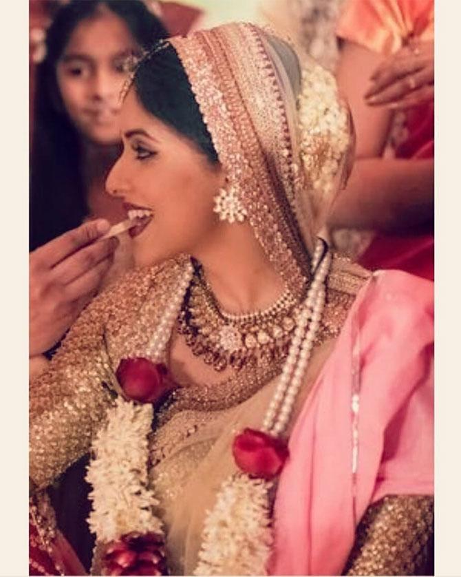 Asin who was the lead actress in Ghajini donned a gold and beige Sabyasachi Mukherjee lehenga, which had a hint of maroon on her big day. Asin married co-founder of Micromax Rahul Sharma