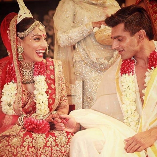 For her wedding, Bipasha Basu donned a traditional red and golden Sabyasachi lehenga-saree and made for a pretty Bengali bride with traditional jewellery. She married television actor Karan Singh Grover