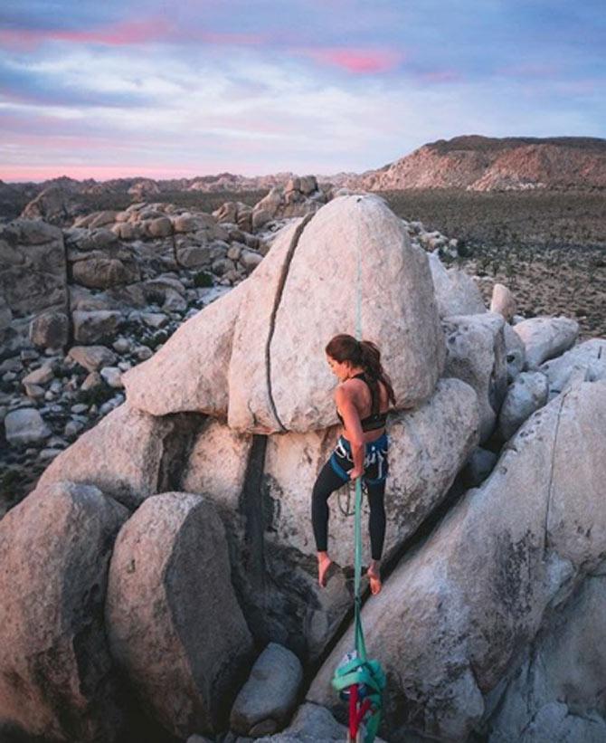 Chelsea Kauai is also passionate about rock climbing and shares a picture of her climbing the boulders of Joshua Tree National Park