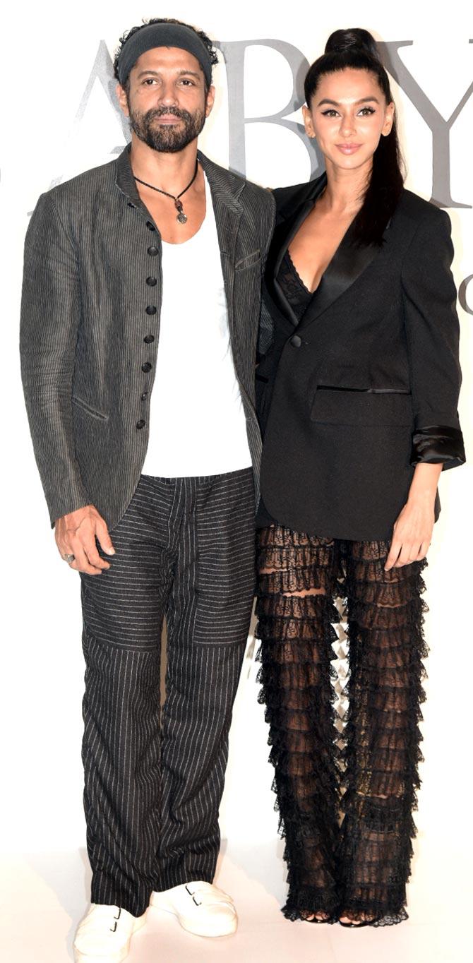 Farhan Akhtar arrived at the event in Mumbai with girlfriend Shibani Dandekar. While Farhan looked dapper in a casual striped suit, Shibani Dandekar upped the fashion game with her lacey pantsuit. 