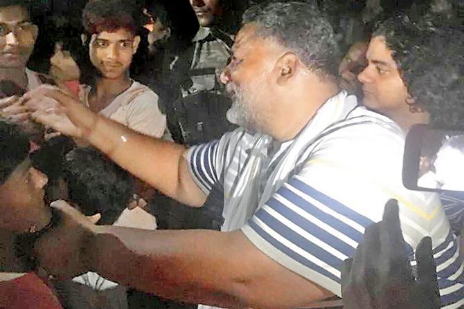 Pappu Yadav (in blue) likes to travel with his supporters on bikes