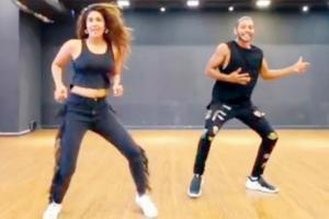 Varun Dhawan matches steps with Harleen Sethi on the song First Class