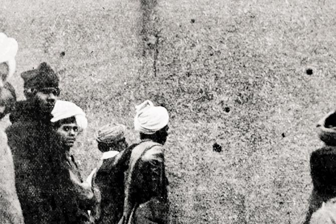 Locals inspecting bullet-holes at Jallianwala Bagh in late 1919. Pic Courtesy/L