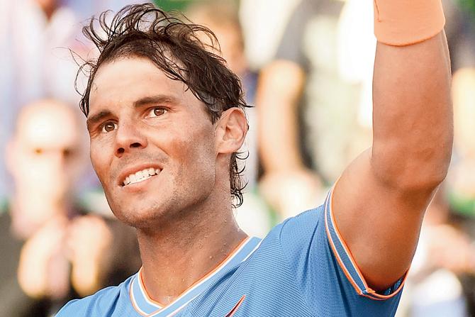 Rafael Nadal celebrates after winning the quarter-final against Argentina
