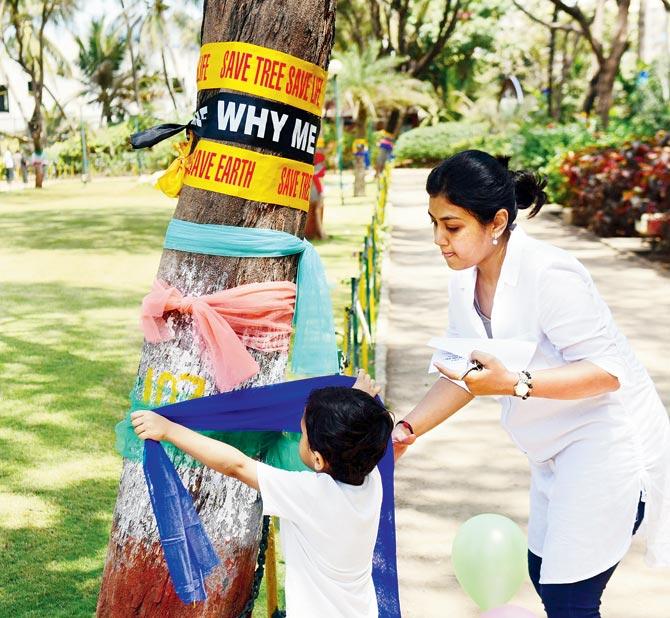 Protesters tie rakhis to the trees