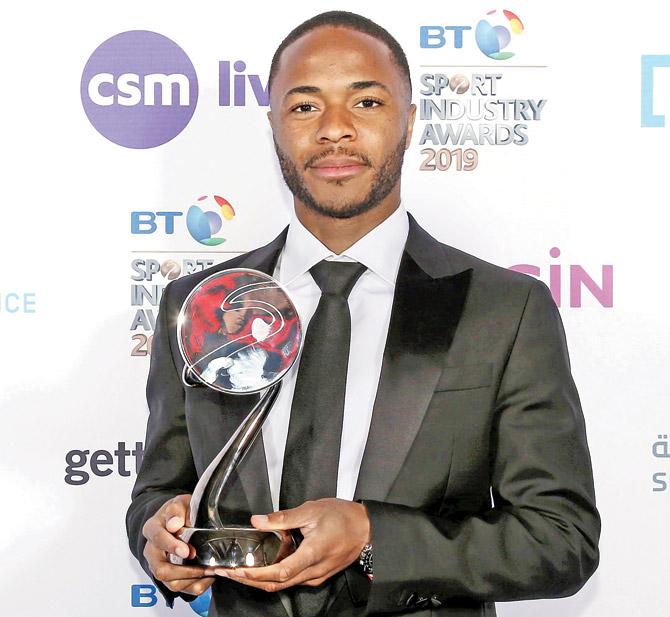 Raheem  Sterling poses with the Integrity and Impact Award