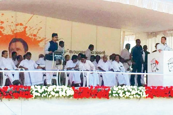 Rashid Gazali with Congress President Rahul Gandhi on stage during the event