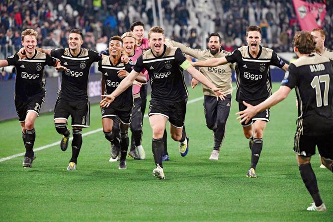 Ajax players celebrate their victory. Pics/AFP