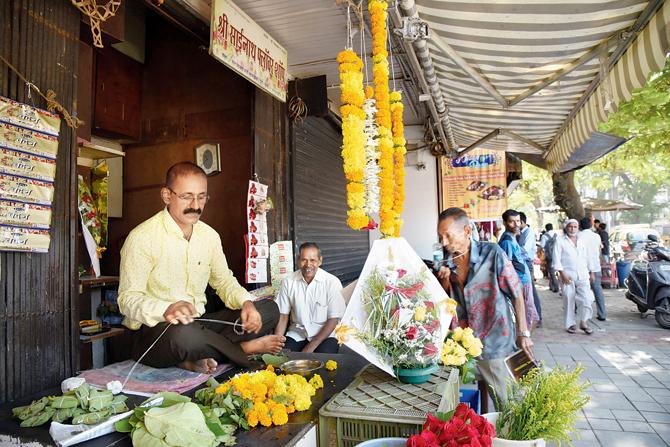 Dilip Salunke at Shri Sainath Flower Shop introduced by his grandfather in 1930. Grateful for business from Jer Baug and Rustom Baug, the florist can reel off perfectly pronounced, significant holy days of the Zoroastrian calendar month, when torans he strings hang at every door