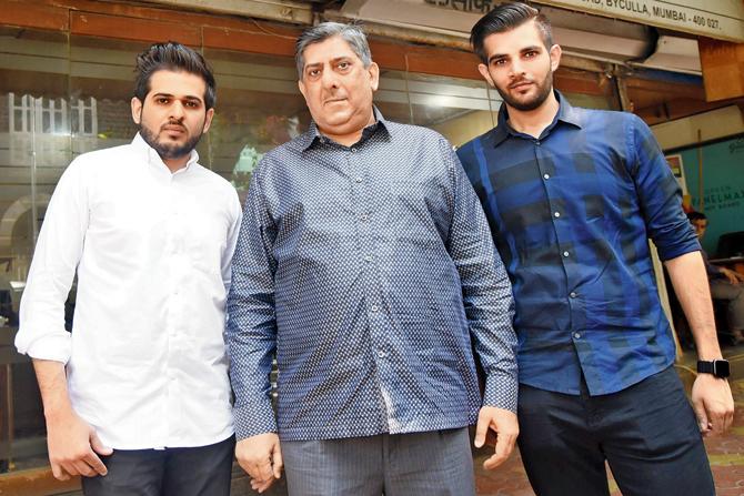 Mohamed Ali Latiff, partner at Latiff Sons, with sons Mobin and Moin outside the family