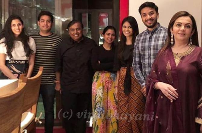 Akash Ambani and Shloka Mehta pose for a picture post the family dinner in Mumbai